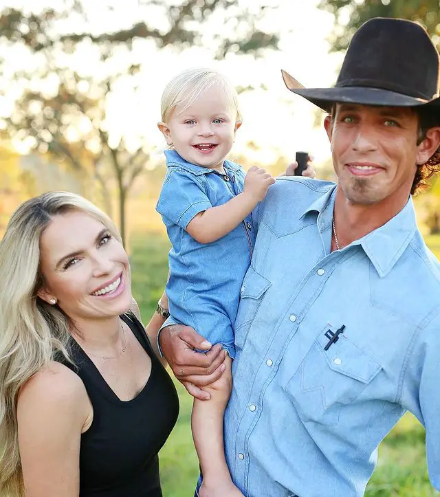 J.B. Mauney with his wife and son