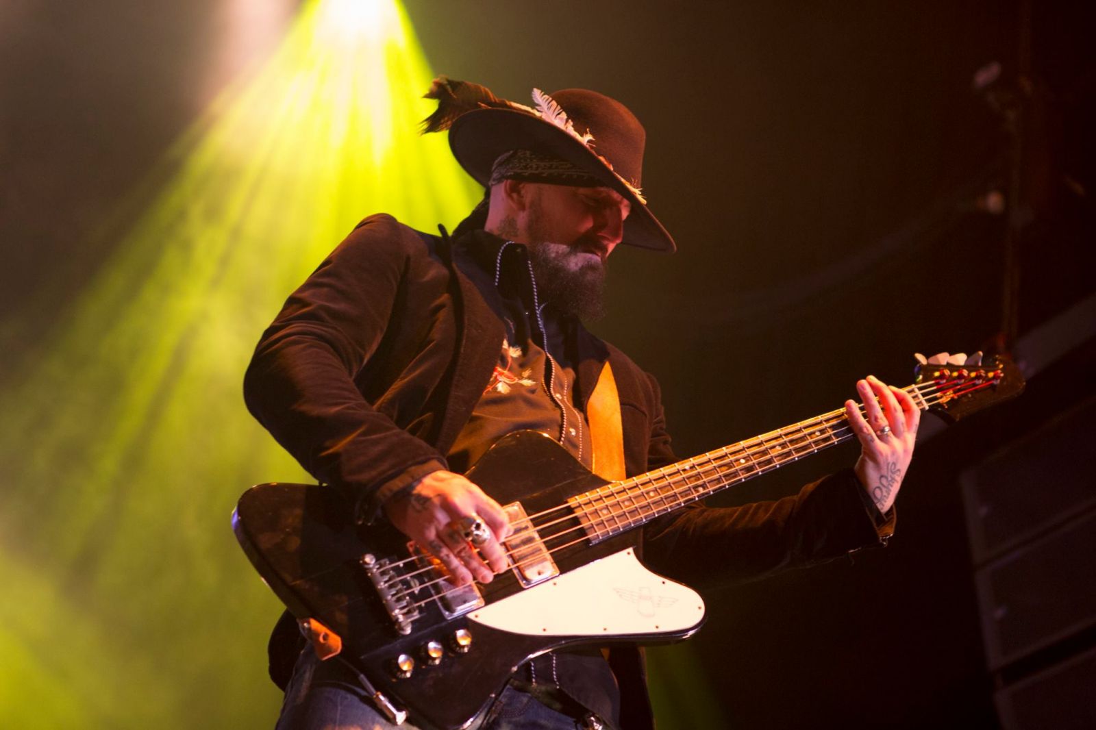 Bassist Johnny Colt Playing at a Show 